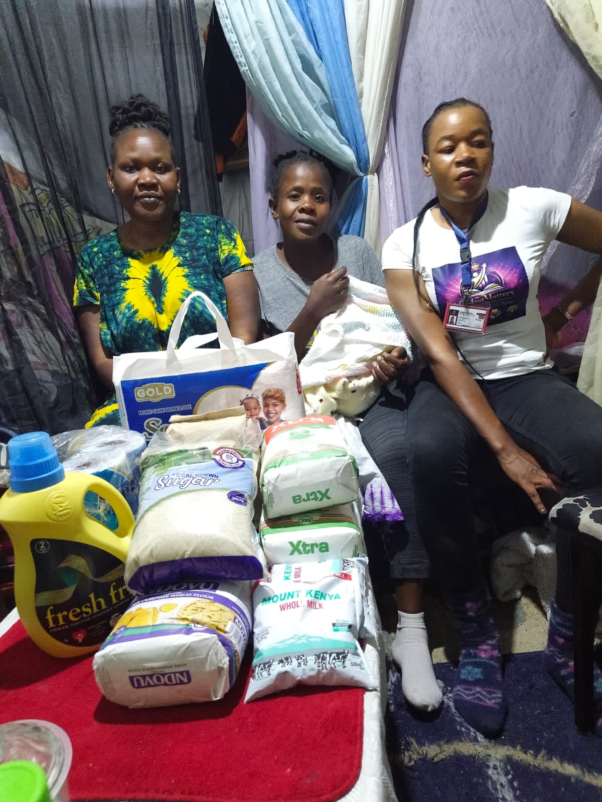 Foundation volunteers visiting a mother and newborn baby at home